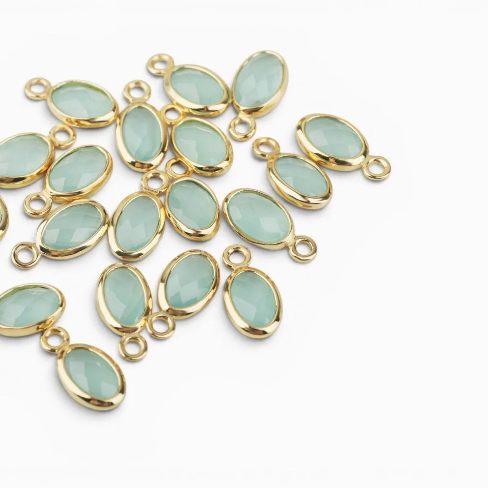 подвеска металл "эллипс", позолота/св.аквамарин, 9x4.5x2 мм